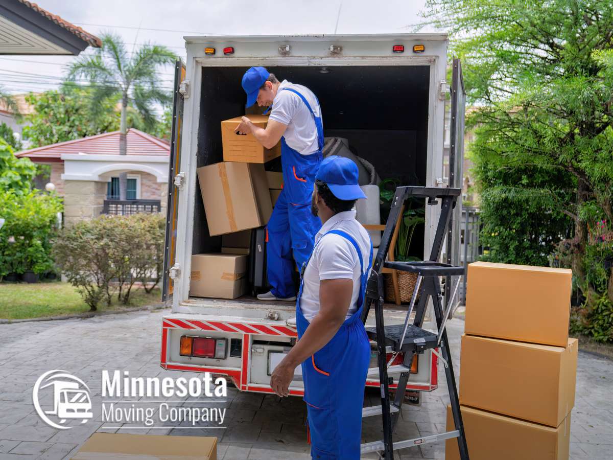 Residential & Commercial Moving Services team loading boxes into truck for a smooth move